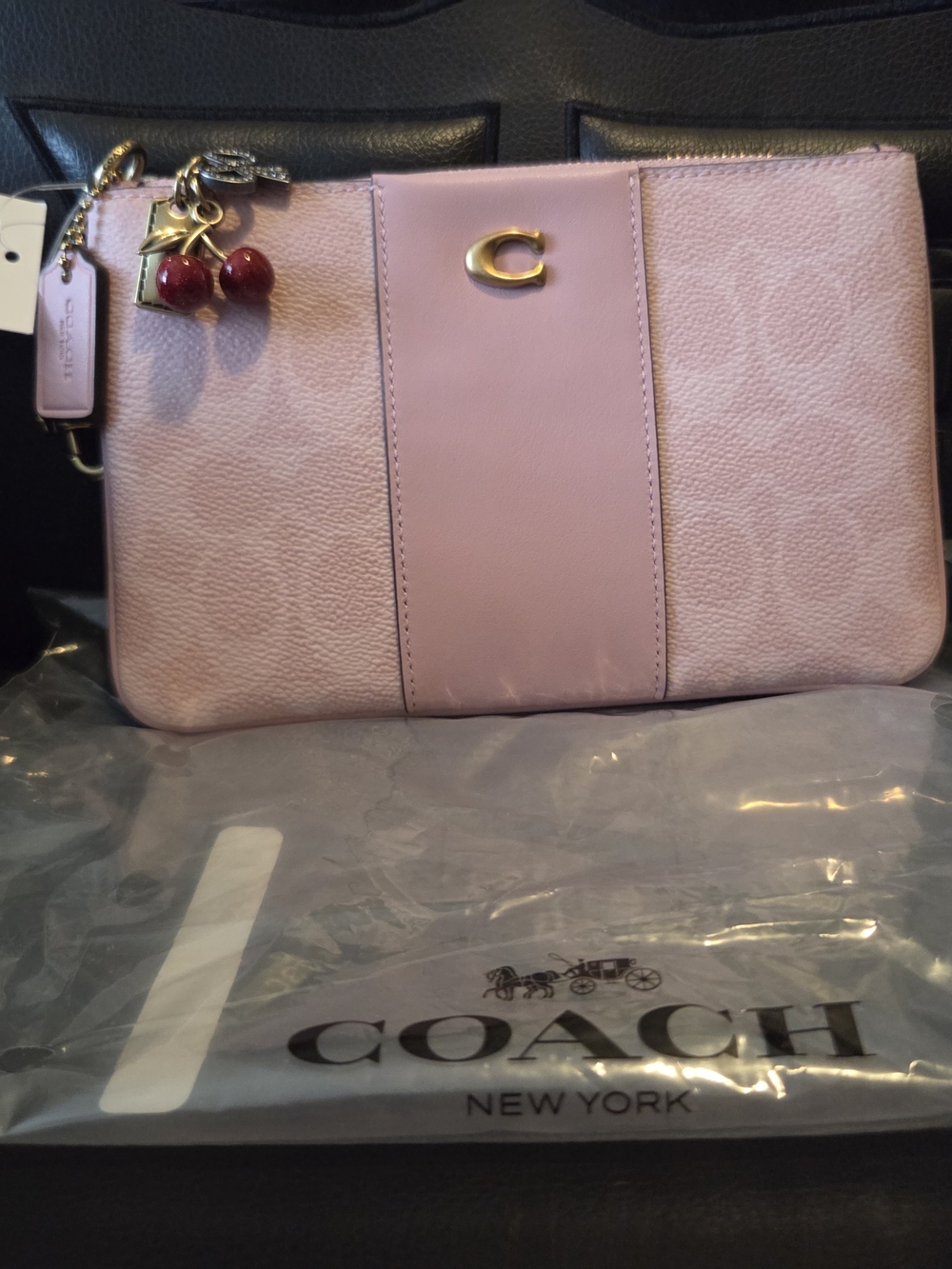 Coach Pink Leather Wristlet with Cherry Charm Accent